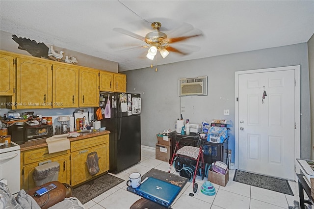 100 SW 67th Ct, Miami, FL 33144 - kitchen featuring freestanding refrigerator, a wall unit AC, a ceiling fan, light tile patterned flooring, and white electric stove