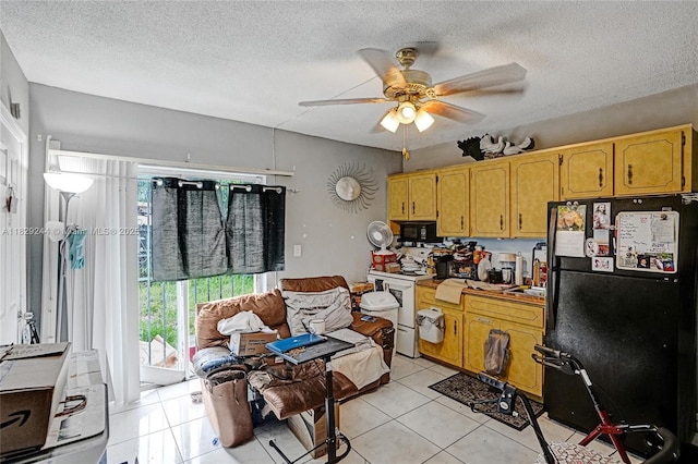 100 SW 67th Ct, Miami, FL 33144 - kitchen featuring black appliances, light tile patterned floors, ceiling fan, and a textured ceiling