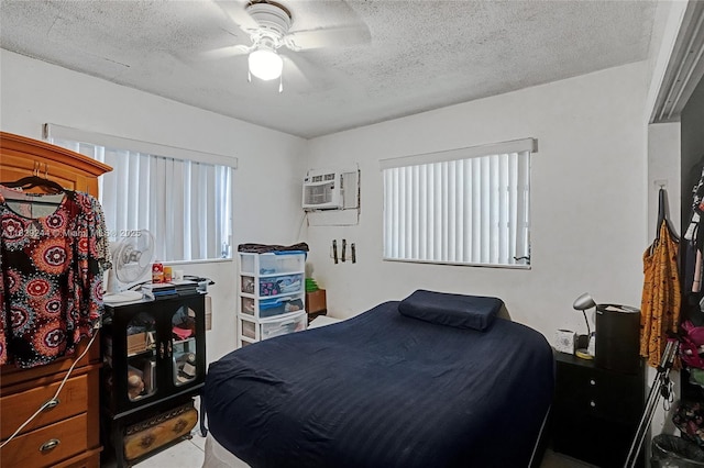 100 SW 67th Ct, Miami, FL 33144 - bedroom with a textured ceiling, an AC wall unit, and a ceiling fan