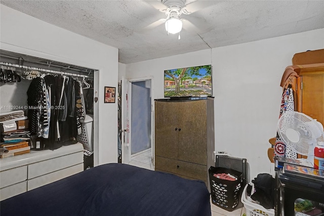 100 SW 67th Ct, Miami, FL 33144 - tiled bedroom featuring a textured ceiling and a ceiling fan
