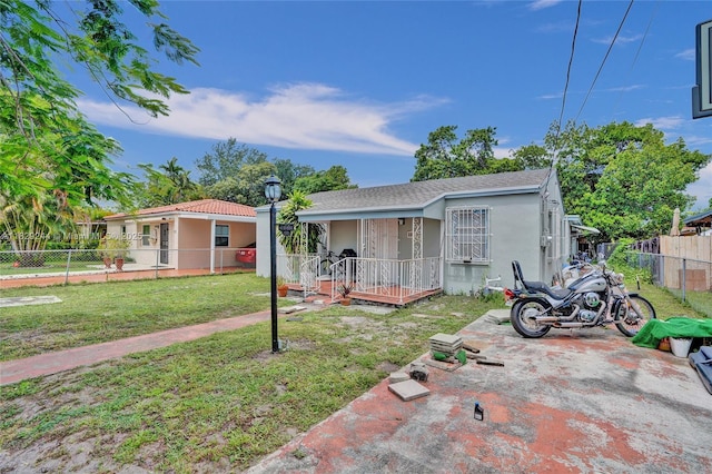 100 SW 67th Ct, Miami, FL 33144 - view of front of property featuring stucco siding and a porch