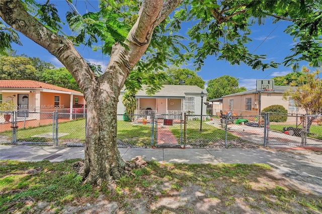 100 SW 67th Ct, Miami, FL 33144 - view of front of property featuring a gate and a fenced front yard