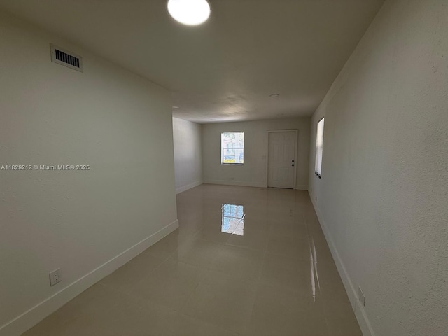 1494 W 34th St, Riviera Beach, FL 33404 - empty room with baseboards and light tile patterned floors