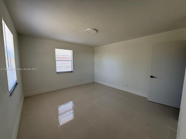 1494 W 34th St, Riviera Beach, FL 33404 - empty room with light tile patterned floors