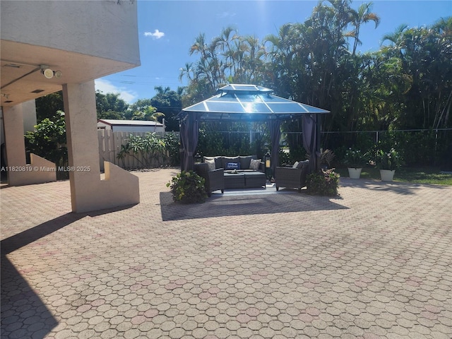 2541 Aragon Blvd Unit 105, Sunrise, FL 33322 - fenced backyard featuring outdoor lounge area, a gazebo, and a patio area