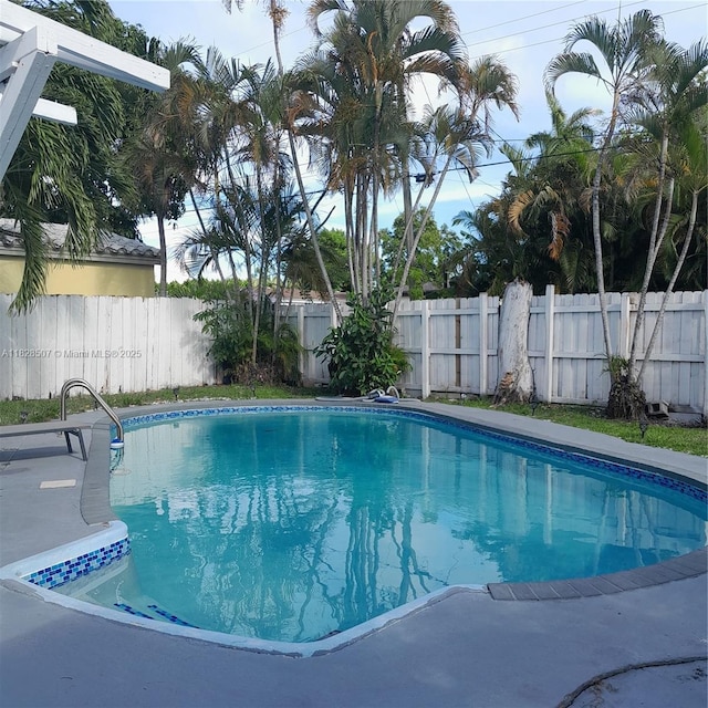 1214 NE 180th St, North Miami Beach, FL 33162 - view of pool with a fenced backyard