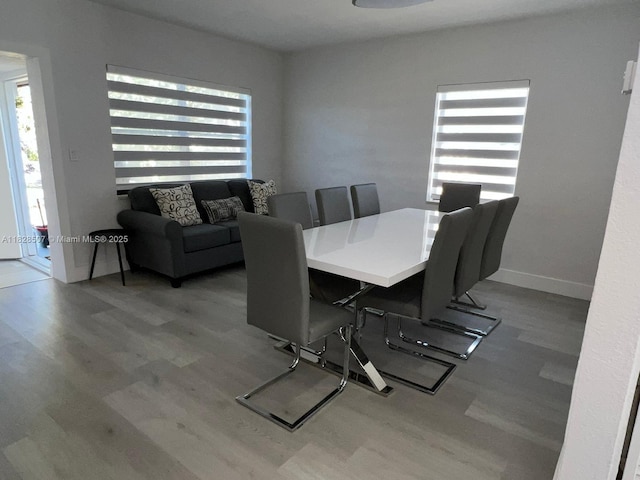 1214 NE 180th St, North Miami Beach, FL 33162 - dining room with plenty of natural light and wood finished floors