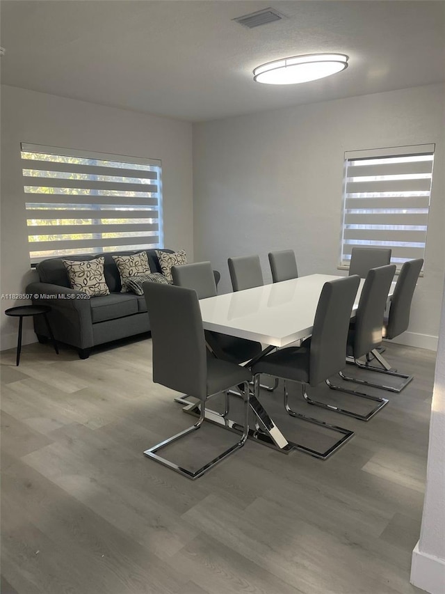 1214 NE 180th St, North Miami Beach, FL 33162 - dining area featuring light wood-style flooring