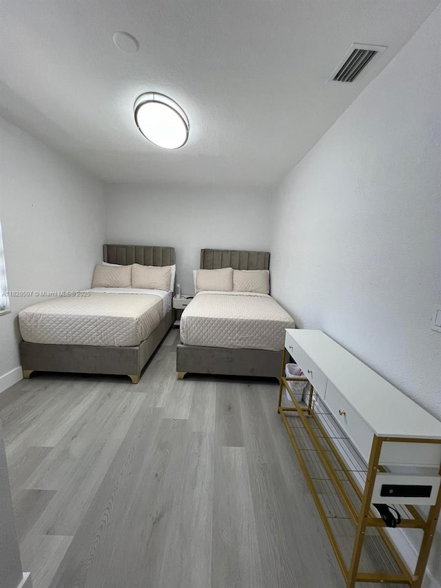1214 NE 180th St, North Miami Beach, FL 33162 - bedroom featuring wood finished floors and baseboards
