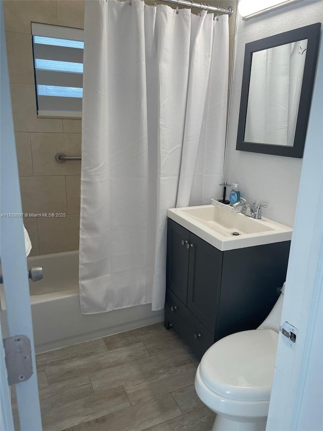 1214 NE 180th St, North Miami Beach, FL 33162 - bathroom featuring vanity, shower / bath combo, and wood finished floors