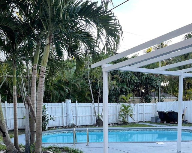1214 NE 180th St, North Miami Beach, FL 33162 - view of swimming pool featuring a fenced backyard