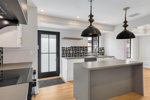 1145 SW 20th Ave, Miami, FL 33135 - kitchen with white cabinets, light wood-style floors, open shelves, pendant lighting, and recessed lighting