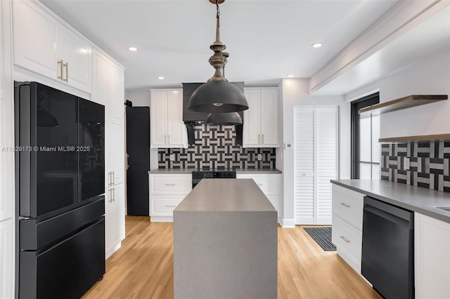 1145 SW 20th Ave, Miami, FL 33135 - kitchen featuring freestanding refrigerator, dishwasher, ventilation hood, backsplash, and white cabinets