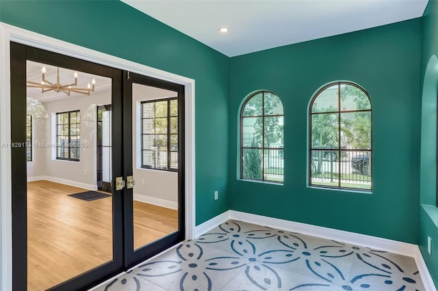 1145 SW 20th Ave, Miami, FL 33135 - unfurnished room featuring french doors, a chandelier, healthy amount of natural light, and recessed lighting