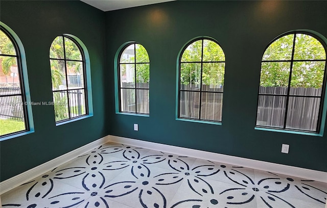 1145 SW 20th Ave, Miami, FL 33135 - unfurnished room with plenty of natural light and tile patterned floors
