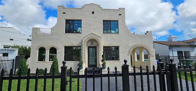 1145 SW 20th Ave, Miami, FL 33135 - view of front of house featuring a fenced front yard, stone siding, and a gate