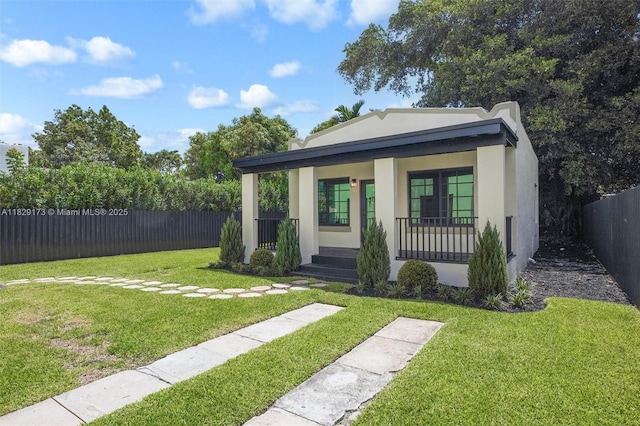 1145 SW 20th Ave, Miami, FL 33135 - bungalow featuring a porch and stucco siding
