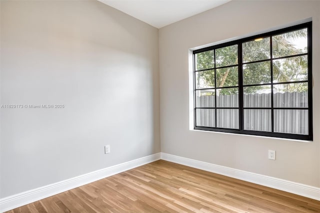 1145 SW 20th Ave, Miami, FL 33135 - empty room with baseboards and light wood-type flooring