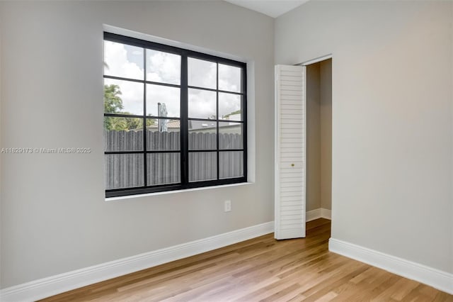 1145 SW 20th Ave, Miami, FL 33135 - unfurnished bedroom with light wood finished floors and baseboards