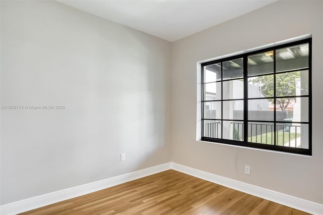 1145 SW 20th Ave, Miami, FL 33135 - empty room featuring baseboards and wood finished floors