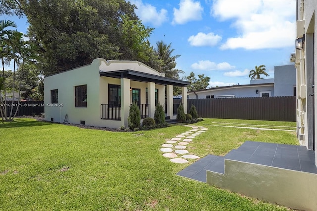 1145 SW 20th Ave, Miami, FL 33135 - back of house featuring covered porch and stucco siding