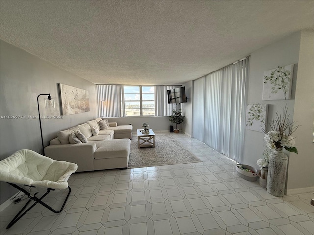 18011 Biscayne Blvd Unit 805, Aventura, FL 33160 - living room featuring a textured ceiling and baseboards