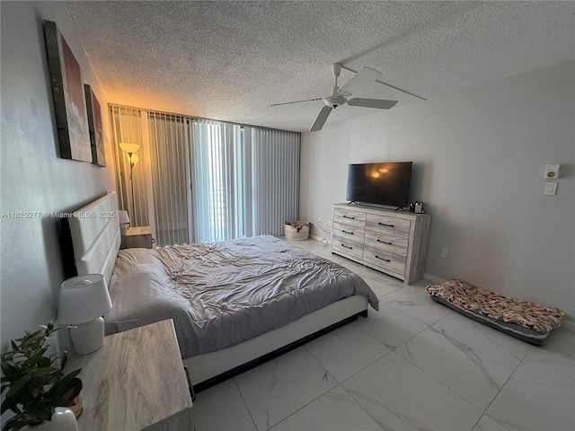 18011 Biscayne Blvd Unit 805, Aventura, FL 33160 - bedroom with marble look tile flooring, a textured ceiling, and a ceiling fan