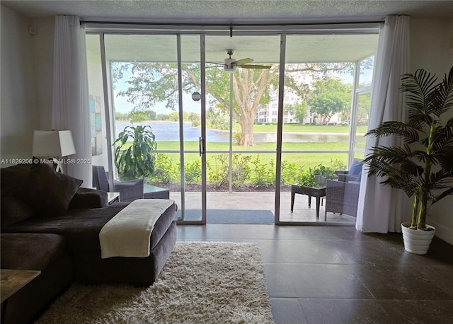 3071 N Course Dr Unit 107, Pompano Beach, FL 33069 - doorway to outside featuring a ceiling fan, a water view, and floor to ceiling windows