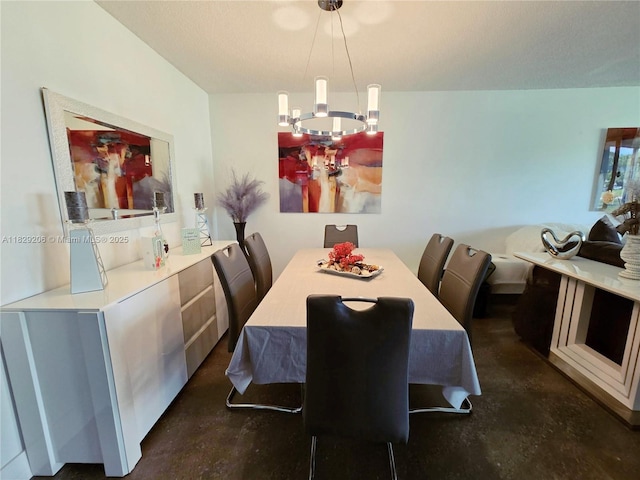 3071 N Course Dr Unit 107, Pompano Beach, FL 33069 - dining space with finished concrete floors and a chandelier