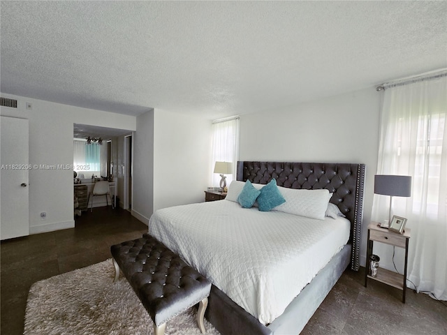 3071 N Course Dr Unit 107, Pompano Beach, FL 33069 - bedroom with a textured ceiling