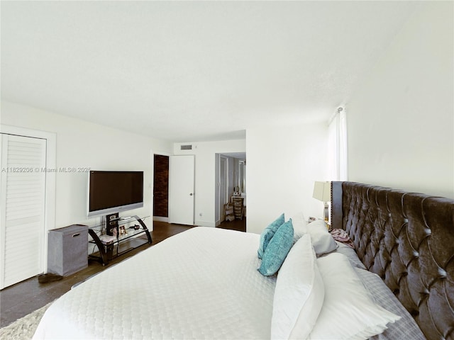 3071 N Course Dr Unit 107, Pompano Beach, FL 33069 - bedroom with dark wood-type flooring