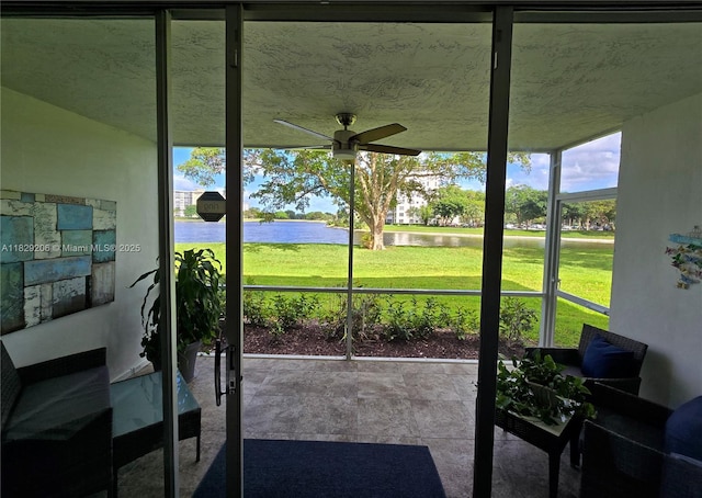 3071 N Course Dr Unit 107, Pompano Beach, FL 33069 - sunroom featuring a water view and a ceiling fan