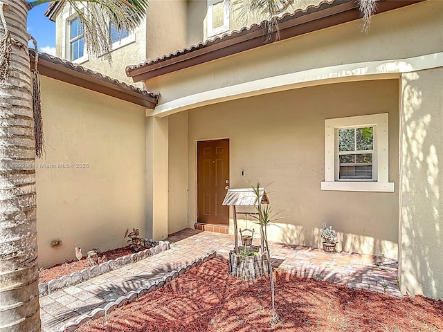 1568 SE 20th Ter, Homestead, FL 33035 - entrance to property with stucco siding and a tile roof