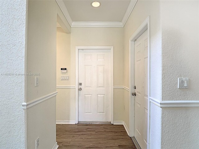 1568 SE 20th Ter, Homestead, FL 33035 - doorway to outside with dark wood-type flooring, ornamental molding, and a textured wall