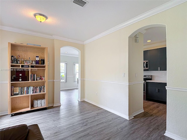 1568 SE 20th Ter, Homestead, FL 33035 - living area featuring arched walkways, wood finished floors, and ornamental molding