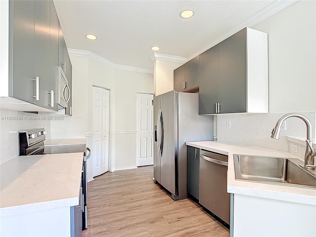 1568 SE 20th Ter, Homestead, FL 33035 - kitchen with appliances with stainless steel finishes, crown molding, recessed lighting, light wood-style floors, and light countertops