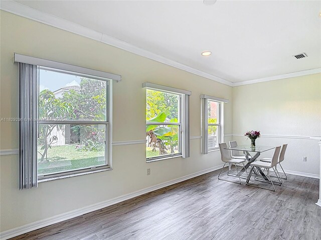 1568 SE 20th Ter, Homestead, FL 33035 - dining room featuring ornamental molding, healthy amount of natural light, and wood finished floors