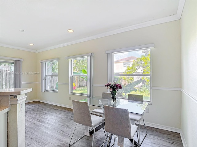 1568 SE 20th Ter, Homestead, FL 33035 - dining space featuring crown molding, wood finished floors, and recessed lighting