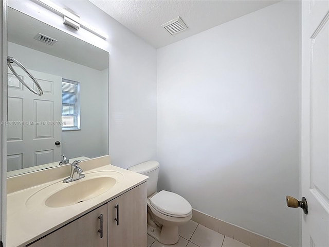 1568 SE 20th Ter, Homestead, FL 33035 - half bathroom with tile patterned floors, vanity, and a textured ceiling