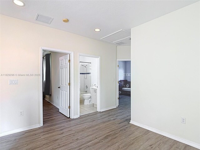 1568 SE 20th Ter, Homestead, FL 33035 - unfurnished room with wood finished floors, a smoke detector, and recessed lighting