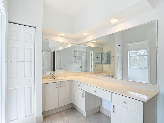 1568 SE 20th Ter, Homestead, FL 33035 - bathroom with a closet, double vanity, tile patterned flooring, and recessed lighting
