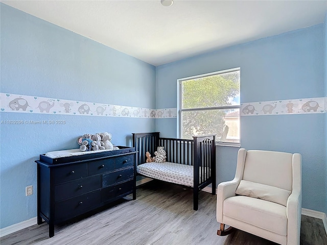 1568 SE 20th Ter, Homestead, FL 33035 - bedroom with wood finished floors and baseboards