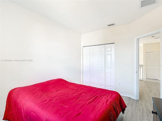 1568 SE 20th Ter, Homestead, FL 33035 - bedroom with light wood-style floors and a closet