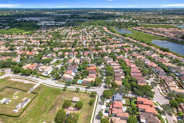 1568 SE 20th Ter, Homestead, FL 33035 - aerial view of property and surrounding area featuring a large body of water and nearby suburban area