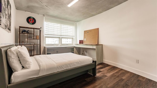3250 NE 1st Ave Unit 1101, Miami, FL 33137 - bedroom featuring dark wood-type flooring and baseboards
