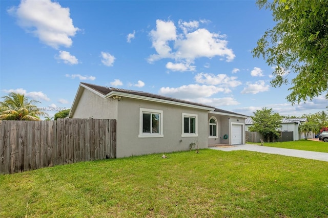13225 SW 218th Ter, Miami, FL 33170 - view of front of home with stucco siding, driveway, and a garage