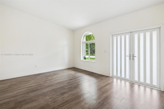 13225 SW 218th Ter, Miami, FL 33170 - empty room with dark wood finished floors and baseboards