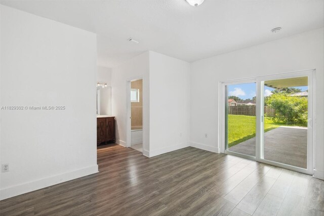 13225 SW 218th Ter, Miami, FL 33170 - unfurnished room featuring wood finished floors and a smoke detector
