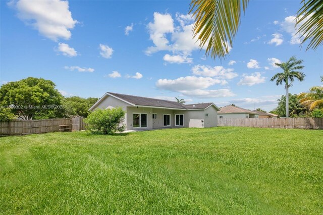 13225 SW 218th Ter, Miami, FL 33170 - rear view of property with stucco siding