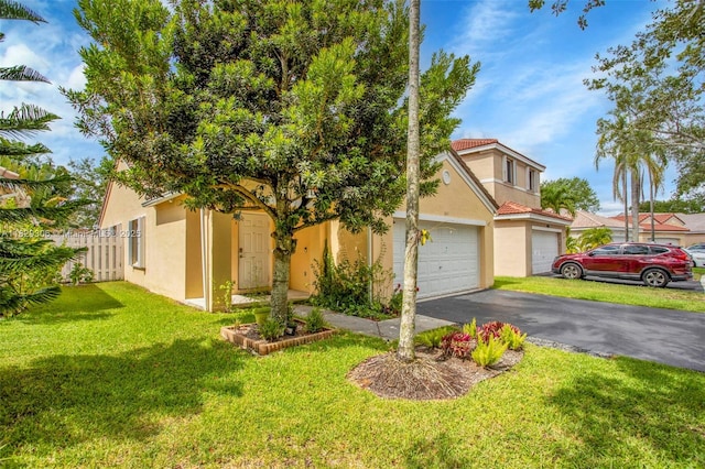 1611 Palermo Dr, Weston, FL 33327 - view of front of house featuring stucco siding, asphalt driveway, and a garage